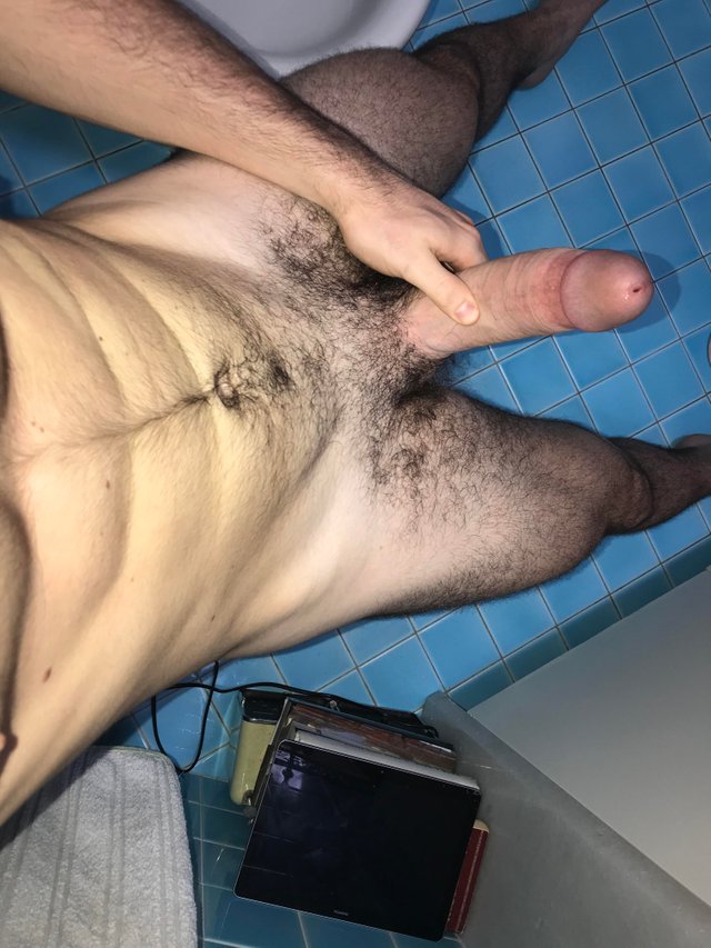 I like to take pictures in the bathroom with my hard cock