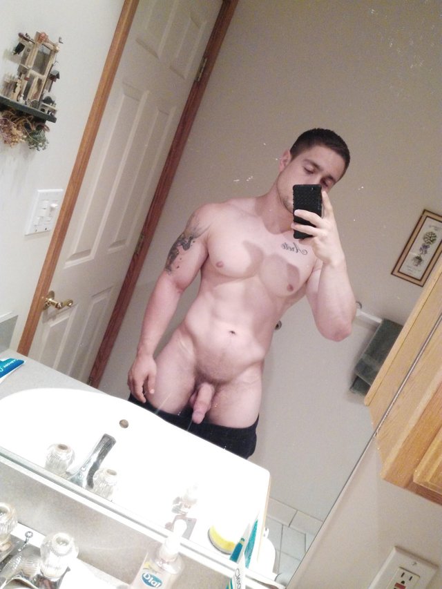 Selfie in the mirror with sexy abdomen and pants down