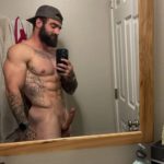 Muscular bearded tattoo guy with upward cut cock
