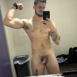 Naked selfie of guy flexing in the lockerroom