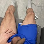 Sports guy pulls shorts down revealing flaccid uncut cock