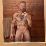 Hot muscular guy with tattoos, beard and huge cut cock