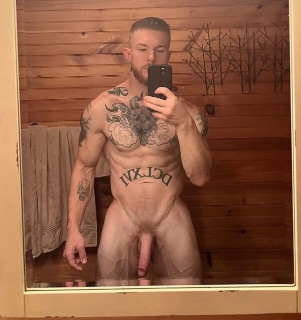 Hot muscular guy with tattoos, beard and huge cut cock